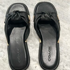 Black Coach flats with gold details